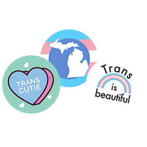3 buttons, one with a heart that reads "Trans Cutie," one with a silhouette of Michigan in trans colors, and one with a trans rainbow that reads "Trans is Beautiful"